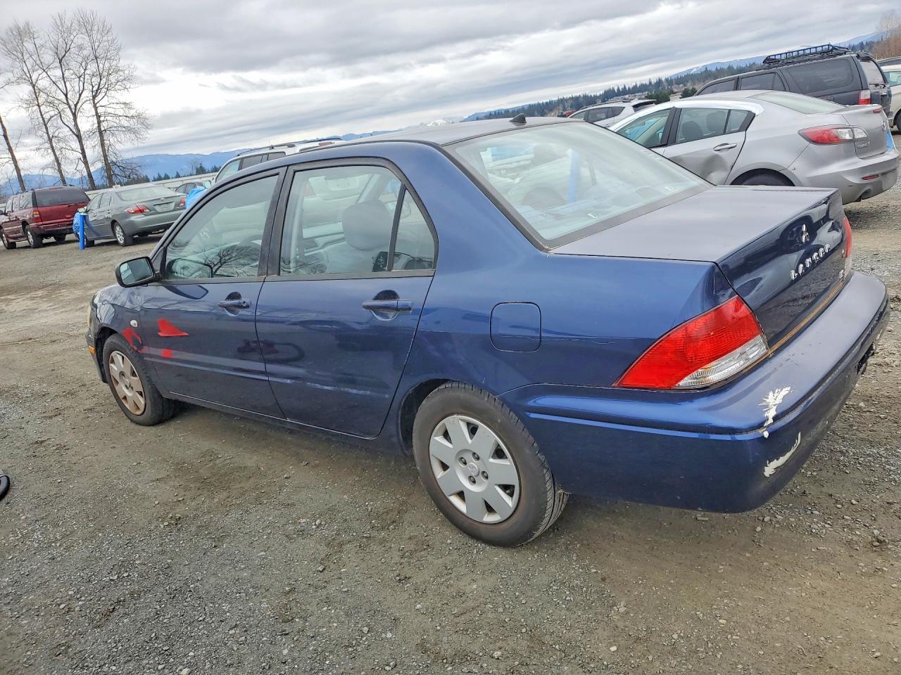 2002 Mitsubishi Lancer Es - Фото 2
