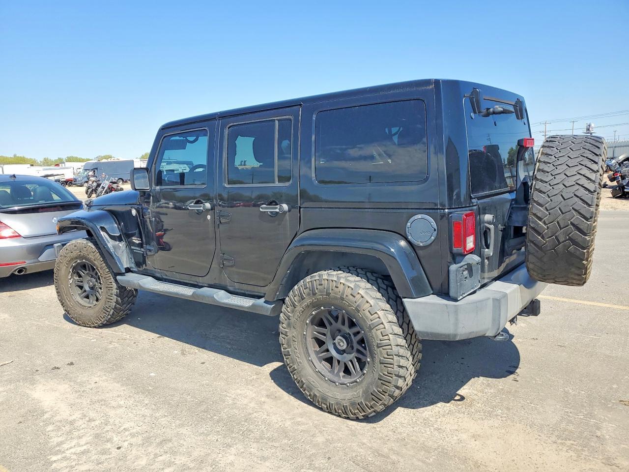 2014 Jeep Wrangler Unlimited Sahara - Фото 2