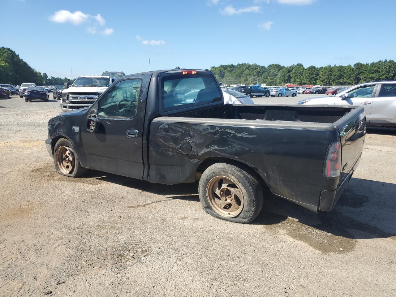 2002 Ford F150 - Фото 2