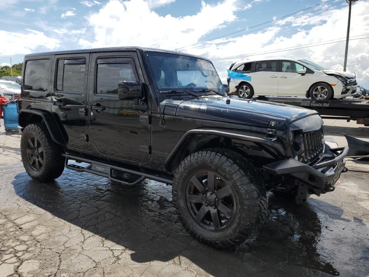 2014 Jeep Wrangler Unlimited Sahara - Фото 4